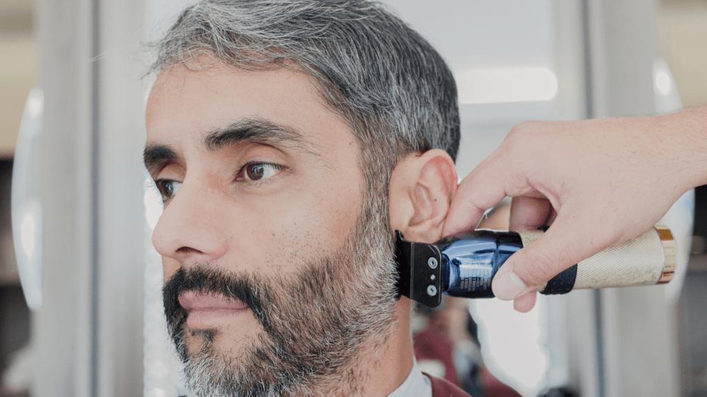 Man getting beard cut 