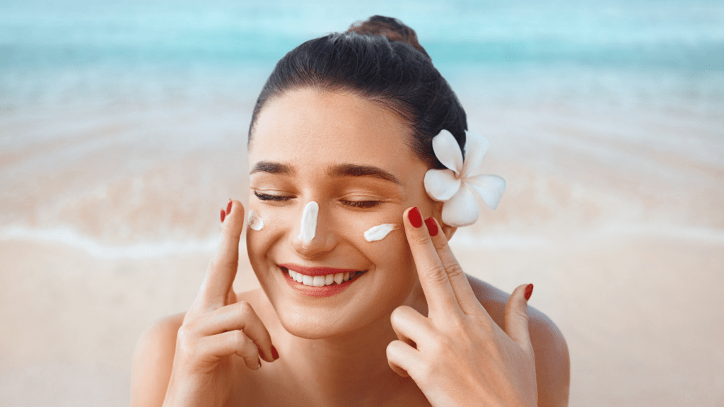 Woman applying sunscreen